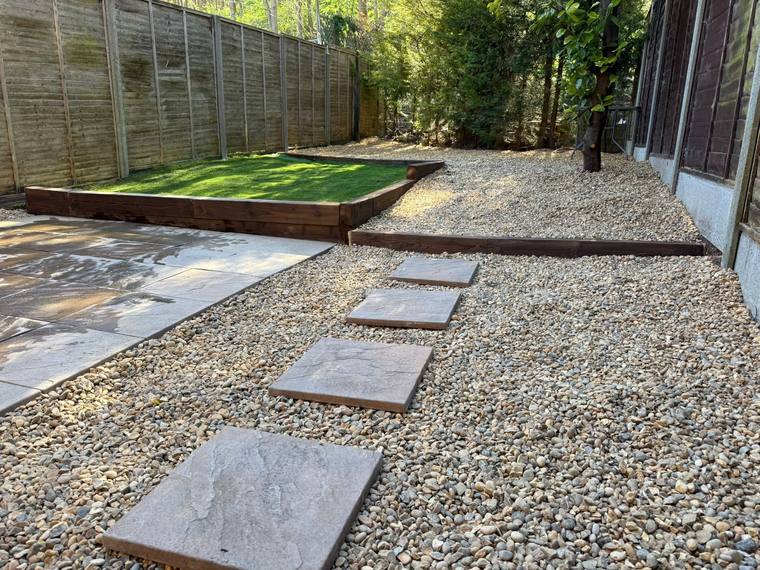 Landscaped garden with stepping stones and lawn after