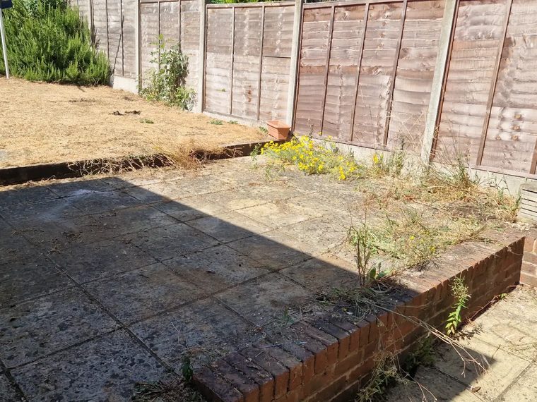Patio cleared and swept after garden waste removal