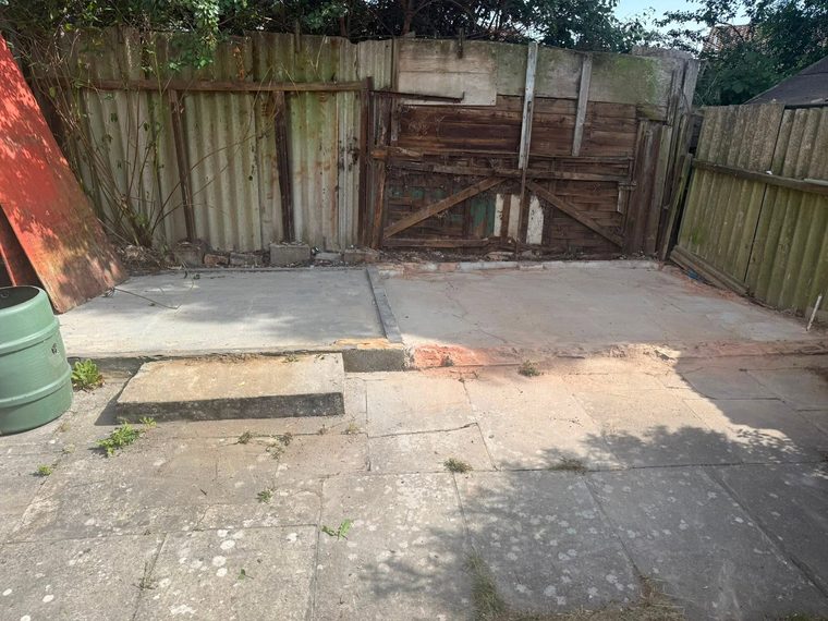 Outbuilding removed leaving a clear concrete base after